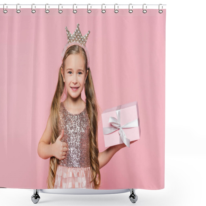 Personality  Joyful Little Girl In Crown Holding Wrapped Present Showing Thumb Up Isolated On Pink  Shower Curtains