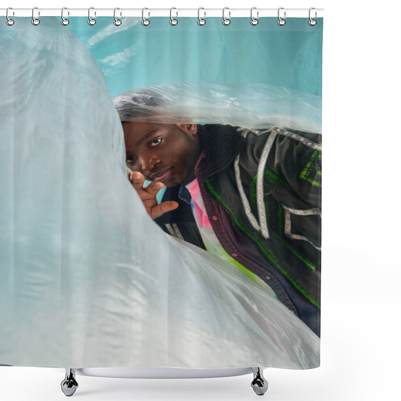 Personality  Fashionable Young African American Man In Outwear Jacket With Led Stripes Standing Near Glossy Cellophane On Turquoise Background, Urban Outfit And Modern Pose, Creative Expression, DIY Clothing  Shower Curtains