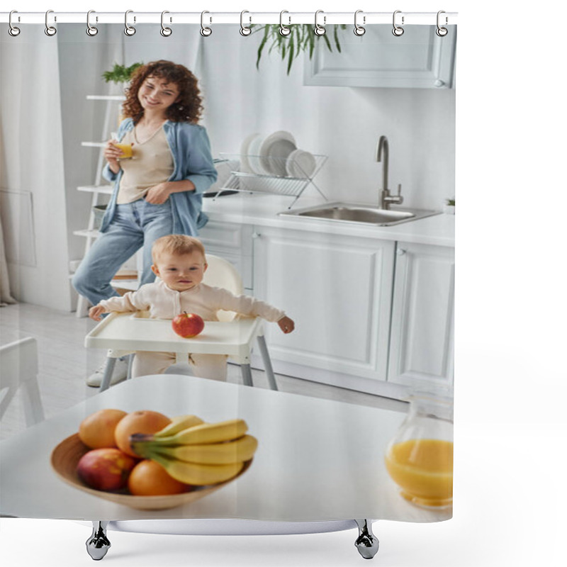 Personality  Joyful Woman With Glass Of Orange Juice Near Toddler Kid In Baby Chair And Ripe Fruits In Kitchen Shower Curtains