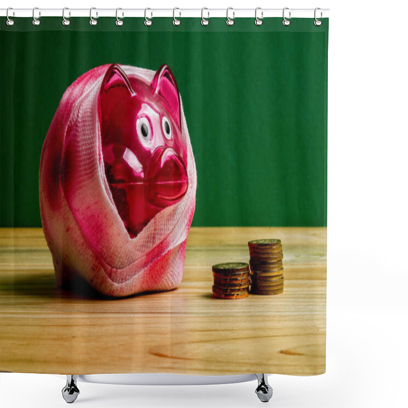 Personality  SAVING  DETERIORATE CONCEPT. Red Piggy Bank With Bandage And Small Stack Of Coins On The Wooden Table Over Green Background. Shower Curtains