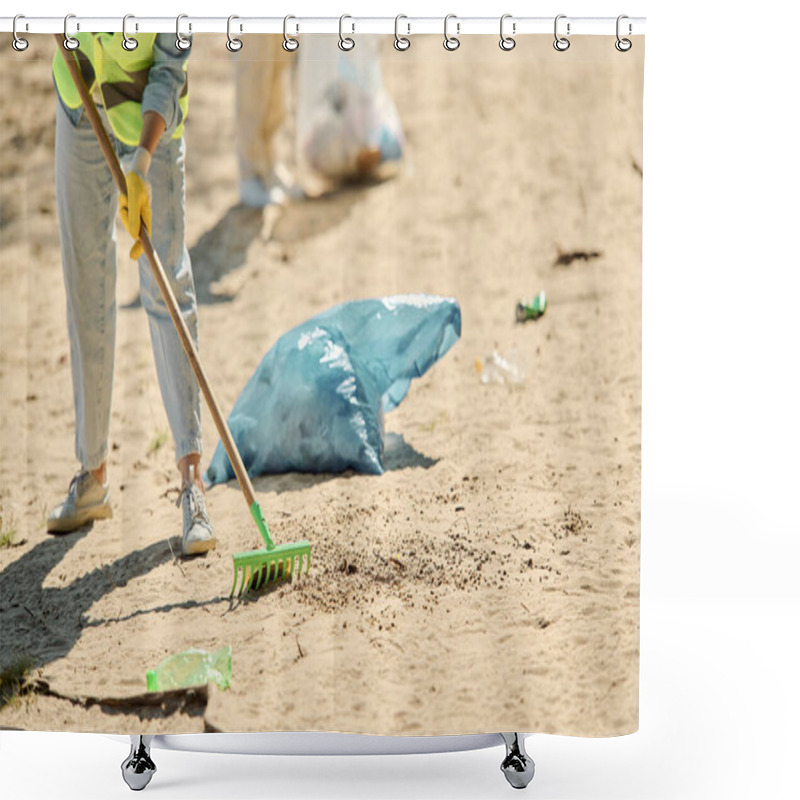 Personality  A Woman In A Safety Vest And Gloves Sweeps Up Trash On The Beach, Embodying The Spirit Of Environmental Stewardship And Care. Shower Curtains