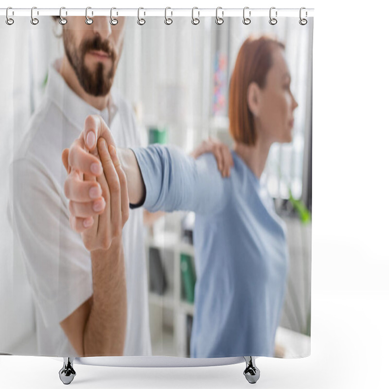 Personality  Bearded Manual Therapist Examining Injured Arm Of Blurred Woman In Consulting Room Shower Curtains