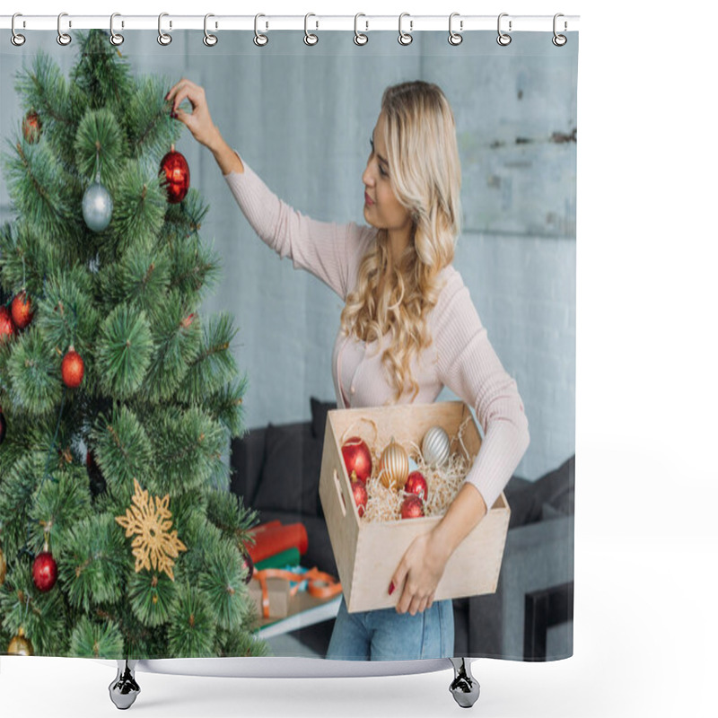 Personality  Side View Of Attractive Girl Decorating Christmas Tree With Baubles And Holding Wooden Box At Home Shower Curtains