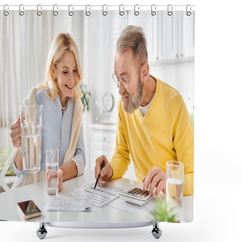 Personality  A Mature Man And Woman In Cozy Homewear Sit At A Table, Engaged In Using A Calculator Together. Shower Curtains