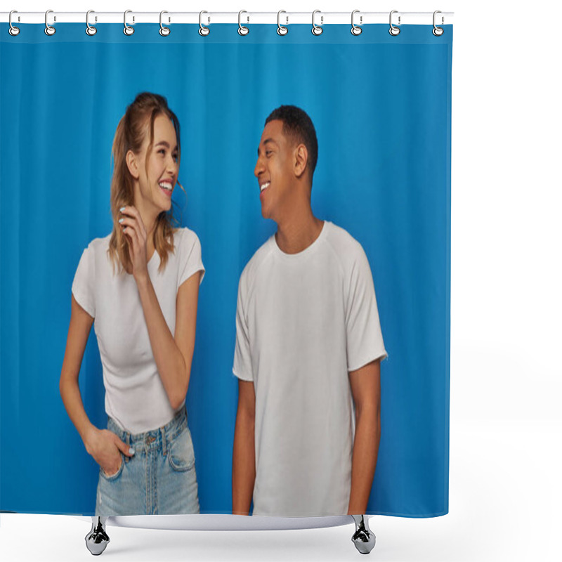 Personality  Cheerful Woman Posing With Hand In Pocket And Looking At African American Friend On Blue Background Shower Curtains