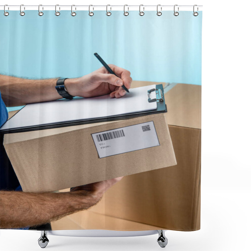 Personality  Cropped View Of Courier Writing On Clipboard With Cardboard Packages Isolated On Blue Shower Curtains