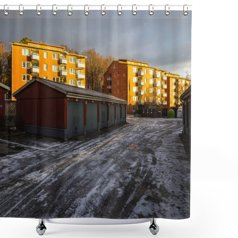 Personality  Garages Line A Snowy Path In A Residential Neighborhood. Apartment Buildings Stand Tall In The Background As The Sun Breaks Through Dark Clouds, Creating A Warm Glow. Shower Curtains